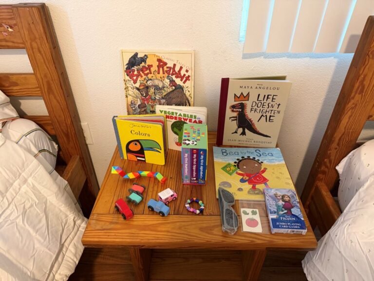 kid beds with nightstand full of books